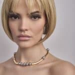 Blonde bob wig with side-swept bangs and layered cut.